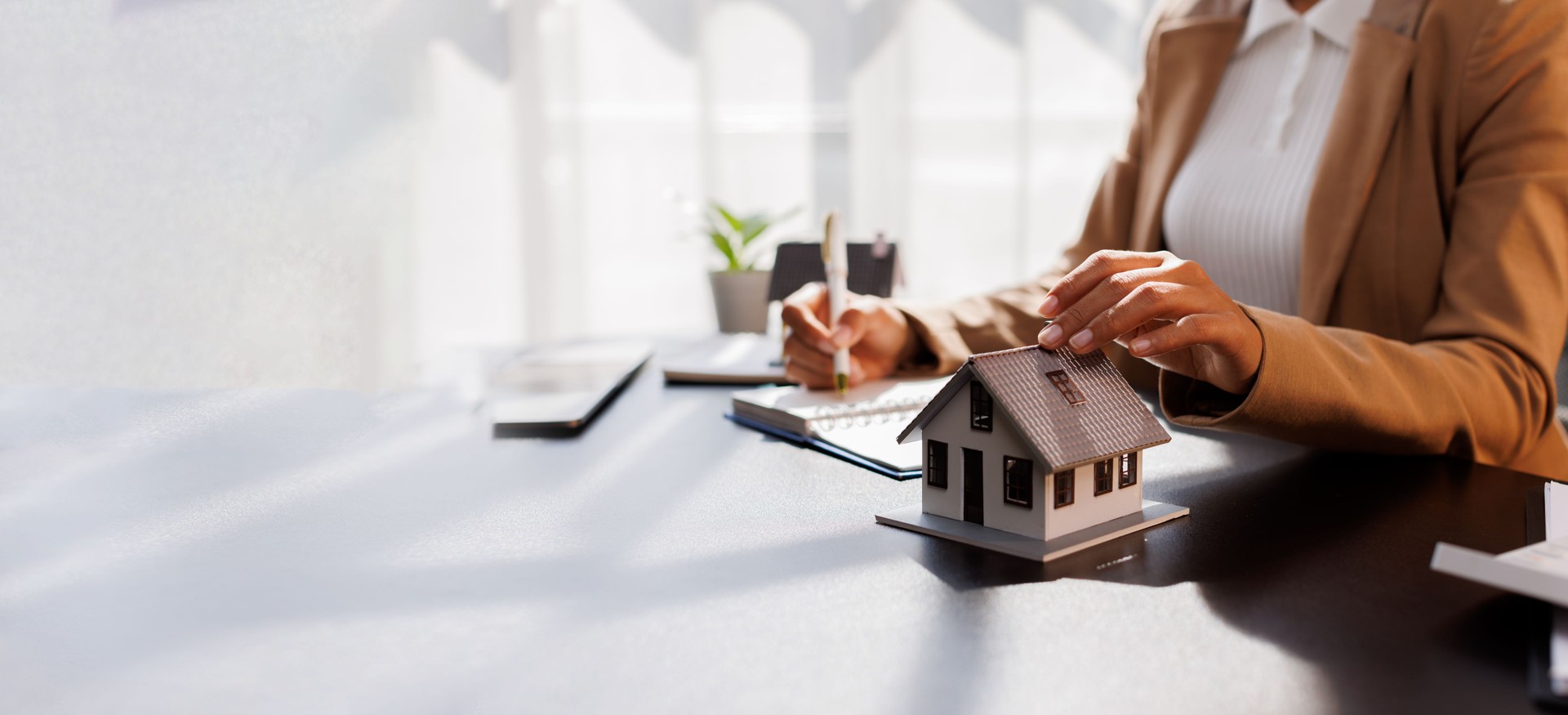 Real Estate Broker agent's signature on the contract finalized the mortgage agreement, marking a significant investment in the housing property for business purposes. Homework